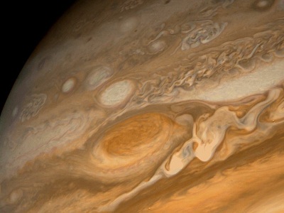 This dramatic view of Jupiter's <a href="/jupiter/atmosphere/J_clouds_GRS.html&edu=elem">Great Red Spot</a> and its surroundings was obtained by <a href="/space_missions/voyager.html&edu=elem">Voyager 1</a> on Feb. 25, 1979, when the spacecraft was 5.7 million miles (9.2 million kilometers) from Jupiter. Cloud details as small as 100 miles (160 kilometers) across can be seen here. The colorful, wavy cloud pattern to the left of the Red Spot is a region of extraordinarily complex end variable wave motion.<p><small><em>Image courtesy of NASA</em></small></p>